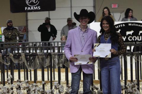 Ryder Day and Kate Smith are presented with scholarships from the Terry County Livestock Association during the Terry County Livestock Show on Saturday at the Terry County Show Barn in Brownfield.