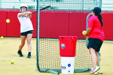 Learning softball skills at Black & Red Camp