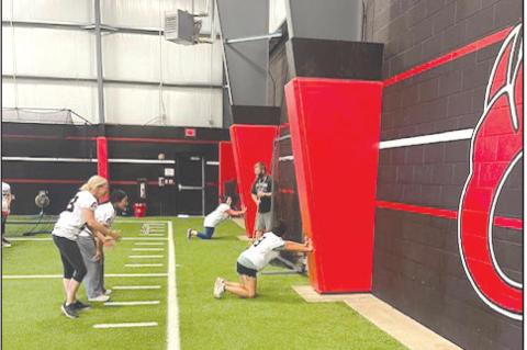 The moms of the Brownfield football players had a chance to see just what their sons go through as they participated in the Cubs’ Mom Clinic last week at the high school