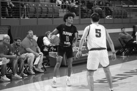 Brownfield’s Trae Timmins (11) looks for a teammate to pass to ball to as Denver City’s Gunner Bradley (5) defends during a District 3-3A game on Tuesday at Dag Azam Gymnasium in Denver City.