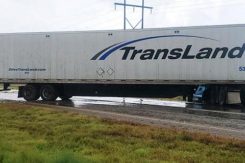 A semi truck traveling