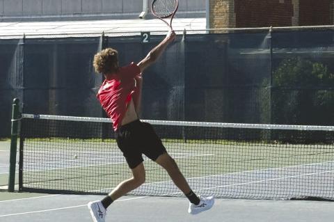 Brownfield’s John Fields hits an overhead smash during a Boys Singles match against Tag Hooks of Peaster at the Region I-3A Tennis Championships on Wednesday at the Rose Park Tennis Center in Abilene. (COURTESY PHOTO)