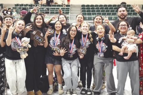 Members of the Brownfield girl's powerlifting team celebrate after winning the team title at the Regional Championships in March at Eldorado High School. (COURTESY PHOTO)