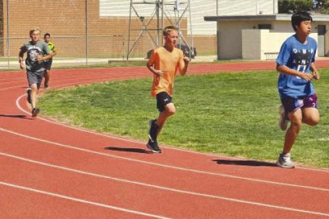 The Wellman-Union athletic programs got to work early for the 2025-26 season, beginning summer workouts last week. Athletes are on the football field, track and in the weight room at the Wildcats and Lady Cats put in the work to improve. (COURTESTY PHOTOS