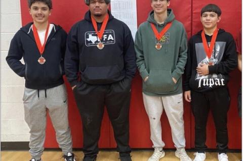 Meadow powerlifters Logan Castaneda (champion, 308-pound division), Eddie Garcia (champion, 148-pound division), Horatio Garcia (fourth, 132-pound division) and Armando Garcia (fourth, 181pound division) show off their medals after competing at the Sundow