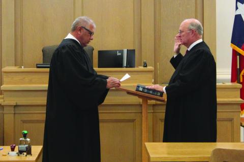 Judge John A. Didway (right) is sworn into office as judge for the Texas 121st District Court by Terry County Judge Tony Serbantez on Jan. 1 at the Terry County Courthouse. (Photos by Lee Scheide|Brownfield News)