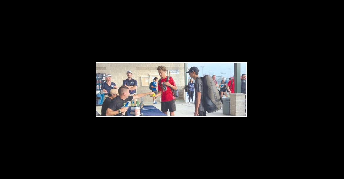 Brownfield's John Fields (center) checks in, along with Corpus Christi London's Cub Quintero, before their first-round match at the Class 3A State Tennis Tournament on Thursday at the Anne Marie Tennis Center in San Antonio. (COURTESY PHOTO)