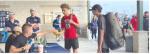 Brownfield's John Fields (center) checks in, along with Corpus Christi London's Cub Quintero, before their first-round match at the Class 3A State Tennis Tournament on Thursday at the Anne Marie Tennis Center in San Antonio. (COURTESY PHOTO)